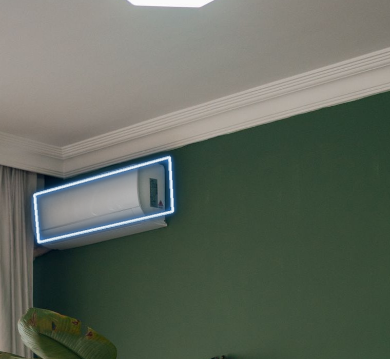A photograph of the room's wall-mounted air conditioner wrapped in a crisp blue neon edge.
