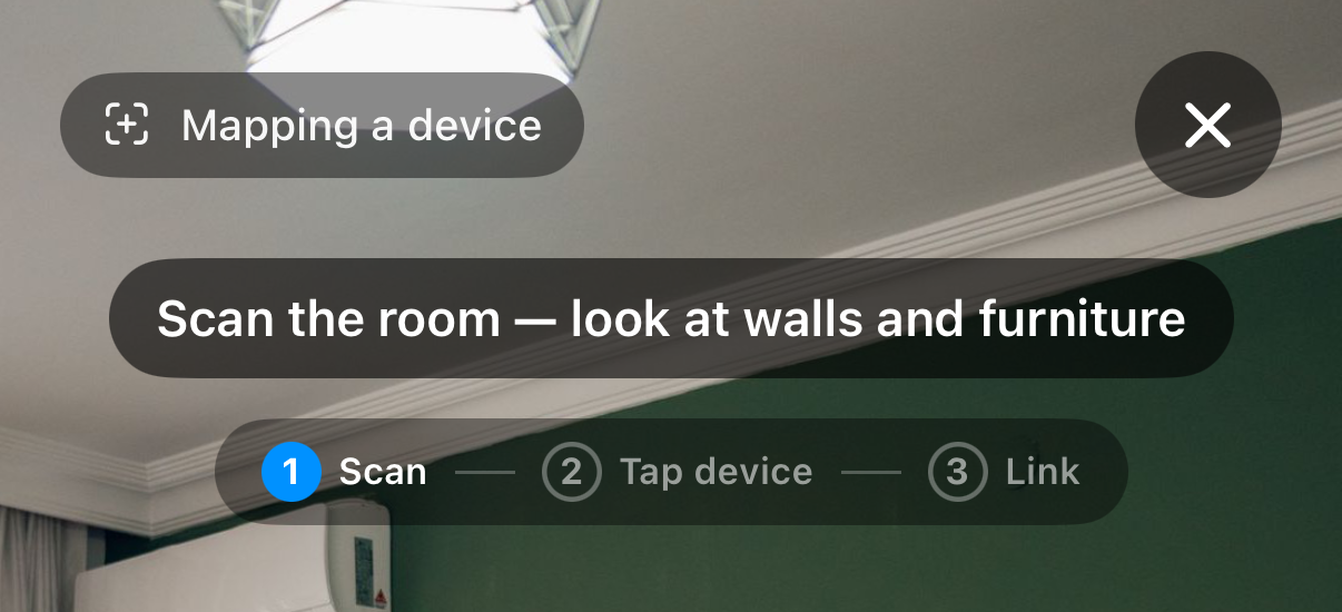 The mapping HUD at step one: a Mapping a device chip, the prompt Scan the room — look at walls and furniture, and a step rail of Scan, Tap device, Link with Scan active.
